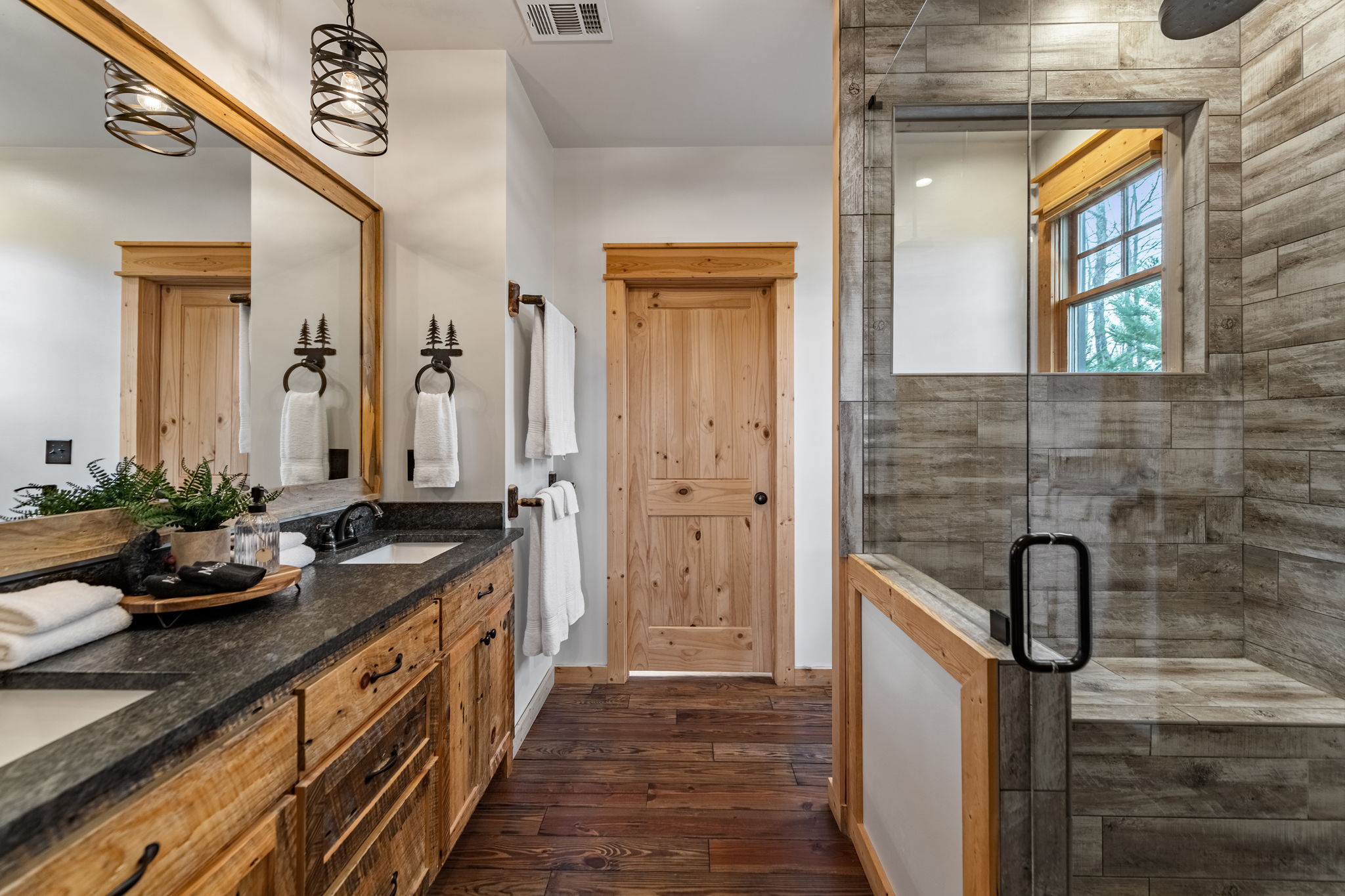 Master bathroom double vanity walk-in shower at luxury cabin rental Blue Ridge Georgia