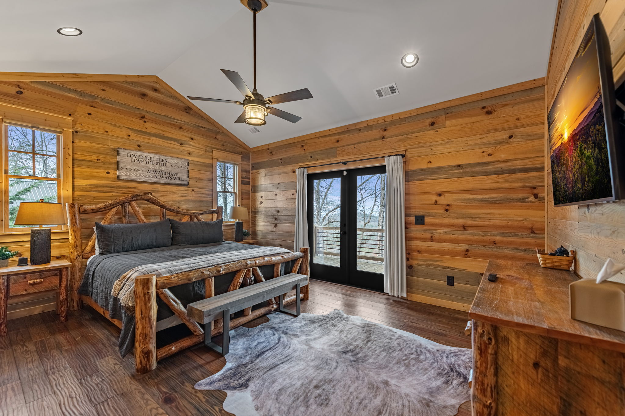 Master bedroom with king log bed at Eversky on Sunrock luxury Blue Ridge GA cabin rental